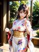 A woman in a kimono standing on a wooden deck.