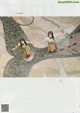 A couple of women standing on top of a tiled floor.